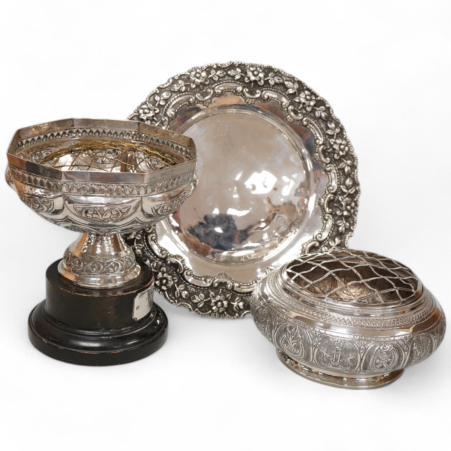 Two Indian white metal rose bowls, one octagonal with stand, diameter 12.5cm, together with a small white metal stand, with foliate border.